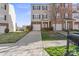 Charming townhome with attached garage, landscaped yard, and inviting entrance at 9724 Walkers Glen Nw Dr, Concord, NC 28027