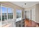 Bright kitchen boasts natural light, hardwood floors, and a functional island with ample storage at 9724 Walkers Glen Nw Dr, Concord, NC 28027
