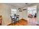 Cozy kitchen nook with a small table, two chairs, wood-look flooring, and natural light from a nearby window at 102 Fire Department Dr, Belmont, NC 28012