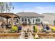 Serene backyard featuring a patio area, gazebo, and garden beds at 1029 Dali Blvd, Mount Holly, NC 28120
