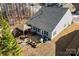 Aerial view of backyard patio with a gazebo, outdoor seating, manicured landscape, and a well-maintained lawn at 1029 Dali Blvd, Mount Holly, NC 28120