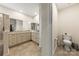 Neutral bathroom with a double sink vanity, ceramic tiled floors, and toilet at 1029 Dali Blvd, Mount Holly, NC 28120
