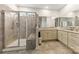 Bright bathroom featuring a glass enclosed shower and double sink vanity at 1029 Dali Blvd, Mount Holly, NC 28120