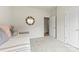 Bright bedroom featuring a decorative mirror and plush carpeting at 1029 Dali Blvd, Mount Holly, NC 28120