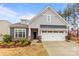 Charming single-Gathering home featuring a well-manicured front yard and two car garage at 1029 Dali Blvd, Mount Holly, NC 28120