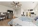 Large primary bedroom with a ceiling fan, wood floors, and natural light at 1029 Dali Blvd, Mount Holly, NC 28120