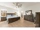 Spacious bedroom with wood flooring, a ceiling fan, and natural light at 1029 Dali Blvd, Mount Holly, NC 28120