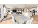 Open-concept living space with a dining area, kitchen island, and cozy seating area at 1029 Dali Blvd, Mount Holly, NC 28120