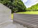 Patio and backyard with privacy fence and green lawn at 11020 Carmel Crossing Rd, Charlotte, NC 28226
