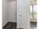 Welcoming entryway with wood flooring, closet for coats and natural light at 11020 Carmel Crossing Rd, Charlotte, NC 28226
