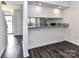 Modern kitchen with granite bar top, white cabinets, and stainless-steel microwave at 11020 Carmel Crossing Rd, Charlotte, NC 28226