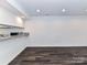 A bright living room featuring sleek floors and a pass-through to the kitchen area at 11020 Carmel Crossing Rd, Charlotte, NC 28226