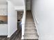 Bright foyer with stairway leading to upper level, showcasing open floor plan at 11020 Carmel Crossing Rd, Charlotte, NC 28226