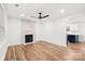 Inviting living room with a modern fireplace, hardwood floors, recessed lighting and an open floor plan at 130 Valley Glen Dr, Troutman, NC 28166