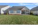 Well maintained backyard with a covered porch perfect for relaxing in the outdoors at 14007 Cameryn Elise Dr, Cornelius, NC 28031