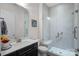 Modern bathroom with stylish gray tile in the shower and black vanity at 14007 Cameryn Elise Dr, Cornelius, NC 28031