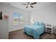 Cozy bedroom with hardwood floors, natural light, and simple decor at 14007 Cameryn Elise Dr, Cornelius, NC 28031