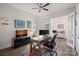 Well-lit home office with desk, chair, and built-in shelving at 14007 Cameryn Elise Dr, Cornelius, NC 28031