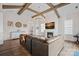 Bright living room features wood beams, fireplace, and hardwood floors at 14007 Cameryn Elise Dr, Cornelius, NC 28031