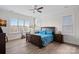 Spacious main bedroom with a ceiling fan and natural light from the large window at 14007 Cameryn Elise Dr, Cornelius, NC 28031