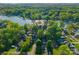 Stunning aerial view of a lakeside community with lush greenery and beautiful waterfront homes at 141 Baywatch Dr, Mooresville, NC 28117