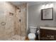 A bathroom featuring a glass enclosed shower, toilet, and vanity at 141 Baywatch Dr, Mooresville, NC 28117