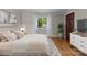A bright bedroom with hardwood floors and white trim at 141 Baywatch Dr, Mooresville, NC 28117