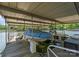 Covered boat lift providing convenient and protected storage for your boat on the tranquil lake at 141 Baywatch Dr, Mooresville, NC 28117