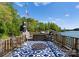 Charming dock featuring a cozy seating area with comfortable chairs and patriotic decor by the lake at 141 Baywatch Dr, Mooresville, NC 28117