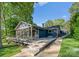 Charming home exterior featuring a spacious deck and screened porch, ideal for outdoor living at 141 Baywatch Dr, Mooresville, NC 28117