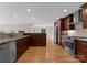 Modern kitchen with stainless steel appliances, granite countertops, and hardwood floors at 141 Baywatch Dr, Mooresville, NC 28117