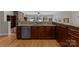 Granite counters and wood cabinets in this kitchen featuring a lake view at 141 Baywatch Dr, Mooresville, NC 28117