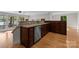 A view of the kitchen featuring granite countertops, stainless steel appliances, and wood cabinets at 141 Baywatch Dr, Mooresville, NC 28117