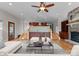 Open living room with a stone fireplace, and hardwood floors at 141 Baywatch Dr, Mooresville, NC 28117