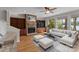 Open-concept living room featuring a stone fireplace, built-in shelves, and a view of the lake at 141 Baywatch Dr, Mooresville, NC 28117