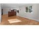 A brightly lit living room with wood floors and large windows at 141 Baywatch Dr, Mooresville, NC 28117