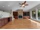 Living room featuring a fireplace, hardwood flooring, and large windows at 141 Baywatch Dr, Mooresville, NC 28117
