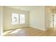 Bright bedroom featuring hardwood floors, a large window, and neutral walls at 17021 Malone Ln, Mint Hill, NC 28227