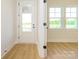 Entryway with light wood flooring, sidelight windows, and a transom window at 17021 Malone Ln, Mint Hill, NC 28227