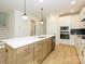 Kitchen with an island, stainless steel appliances, and wood flooring at 17021 Malone Ln, Mint Hill, NC 28227