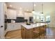 Bright kitchen features a large island with seating, stainless steel appliances and modern finishes at 17021 Malone Ln, Mint Hill, NC 28227