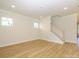 A bright living room features hardwood flooring, staircase, and ample natural light at 17021 Malone Ln, Mint Hill, NC 28227