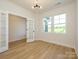 Bright office with french doors, hardwood floors, and large windows overlooking outdoor view at 17021 Malone Ln, Mint Hill, NC 28227