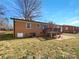 The backyard features a deck and a patio at 207 Bright Ave, Bessemer City, NC 28016