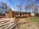 Charming brick single-story home with manicured landscaping and a cozy front yard at 207 Bright Ave, Bessemer City, NC 28016
