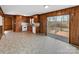 The kitchen showcases warm wood cabinets and a sliding door leading to a private outdoor deck at 207 Bright Ave, Bessemer City, NC 28016