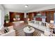 Inviting staged living room showcasing hardwood floors, and an open floor plan to the dining area at 207 Bright Ave, Bessemer City, NC 28016