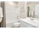 Bathroom showcasing a bath tub, white fixtures, a vanity, and a large mirror with a framed art piece at 2159 Primm Farms Dr # C, Charlotte, NC 28216