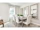Bright dining area boasts seating for six, complemented by elegant mirrors at 2159 Primm Farms Dr # C, Charlotte, NC 28216
