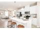 Open kitchen with island seating flows into living room space at 2159 Primm Farms Dr # C, Charlotte, NC 28216